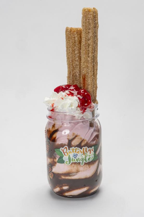 Strawberry sundae with churros in a glass