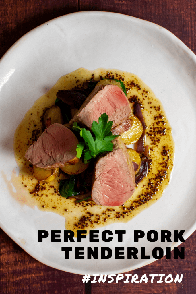 pork tenderloin, vegetables & honey mustard sauce on a white plate