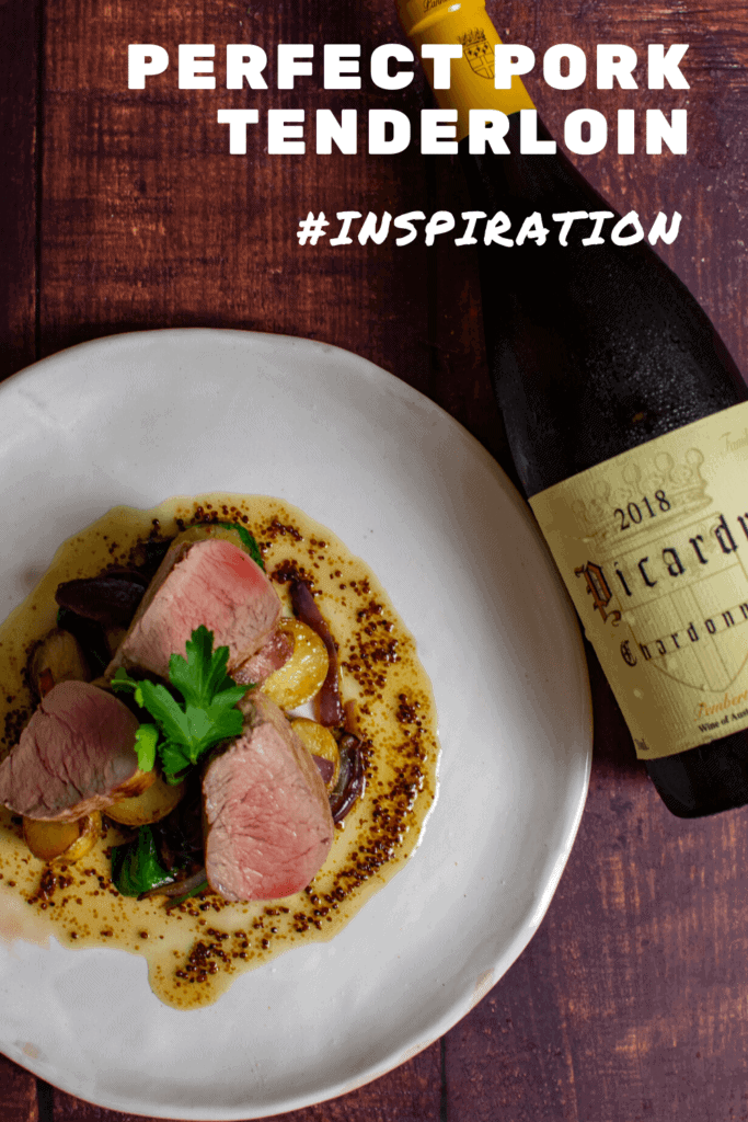 pork tenderloin and vegetables on a white plate - bottle of picardy chardonnay