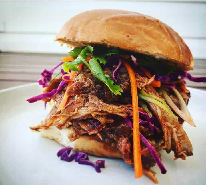 Pulled pork sandwich on a white plate