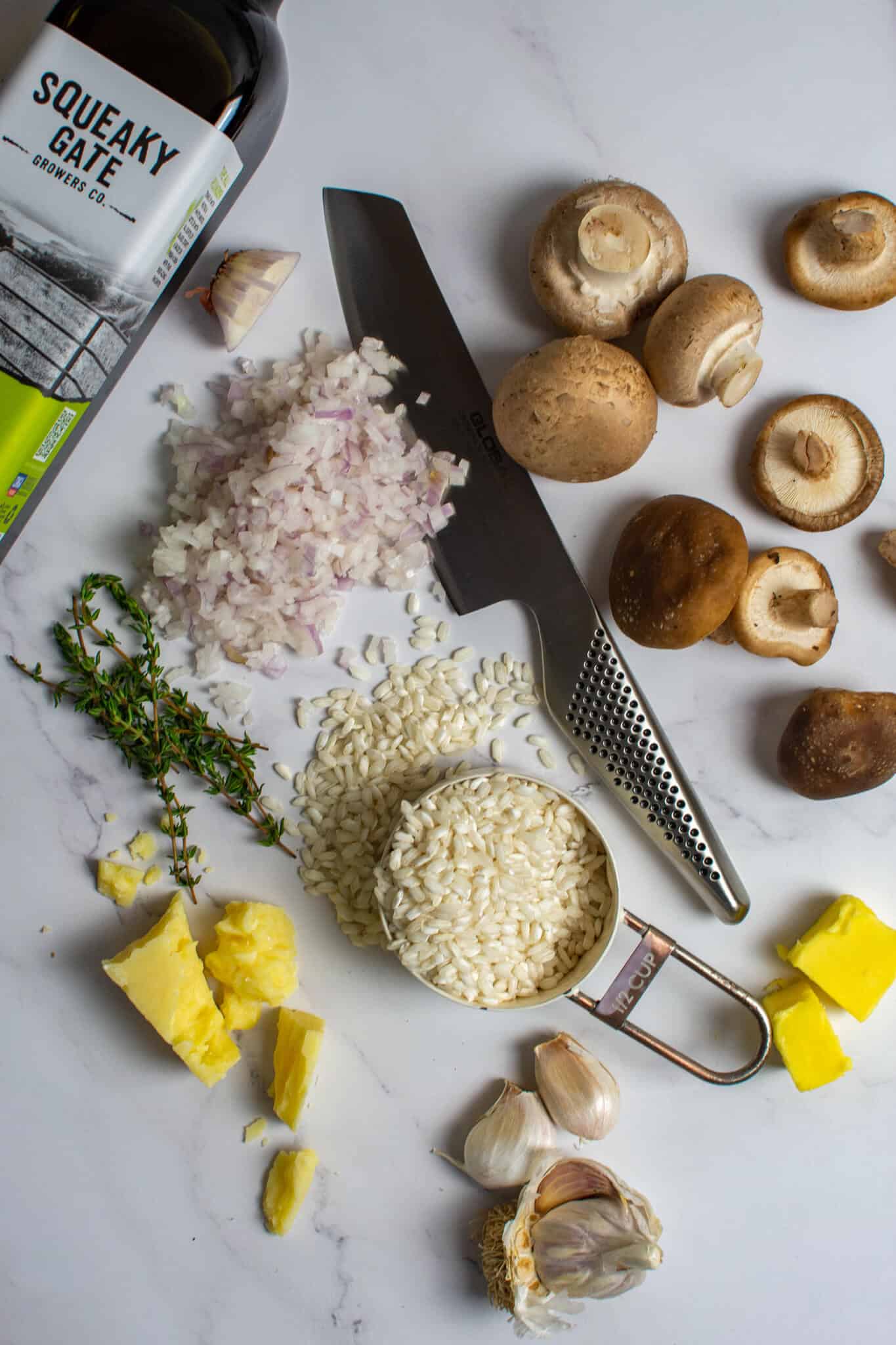 ingredients for wild mushroom risotto on kitchen counter top