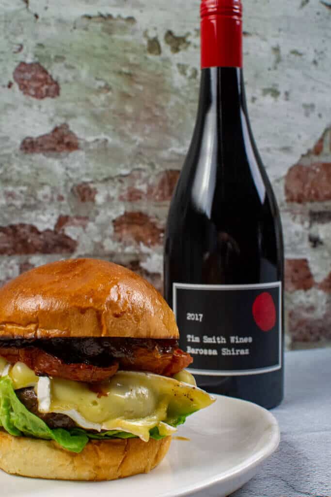 tim smith barossa shiraz and a beef burger on white plate