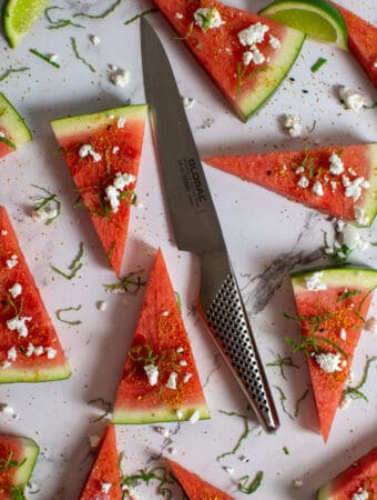 watermelon topped with togaroshi, mint & feta. Global GS-60 knife