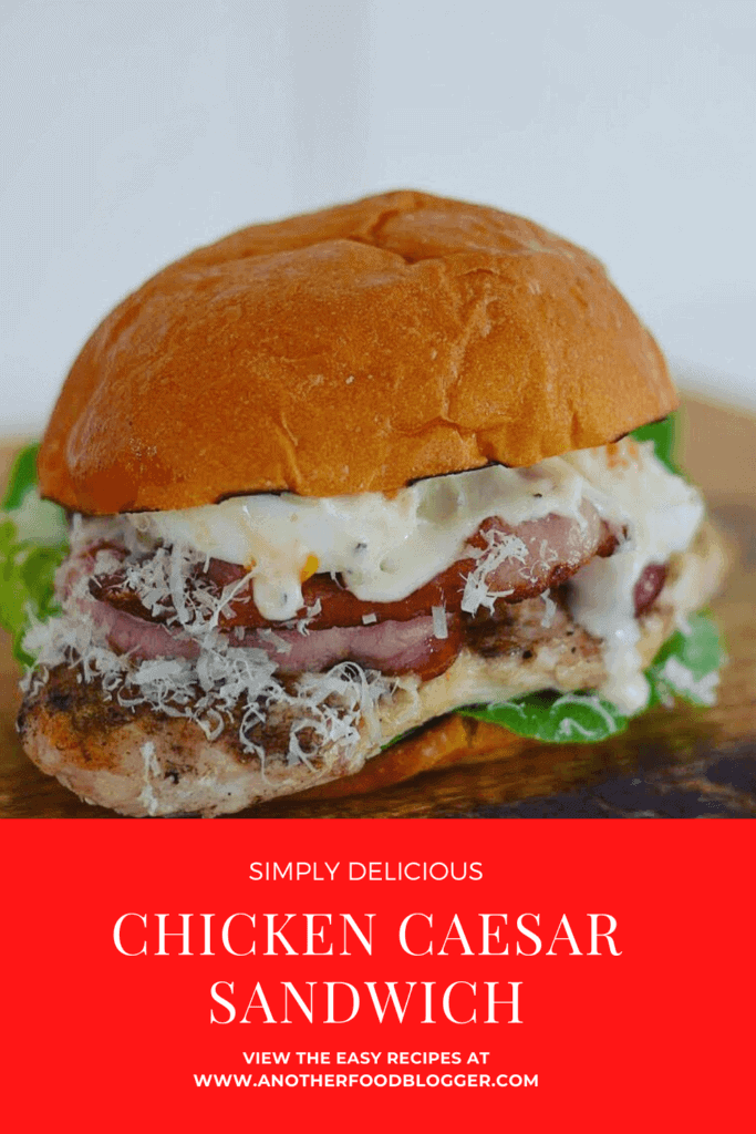 chicken caesar sandwich on wooden chopping board