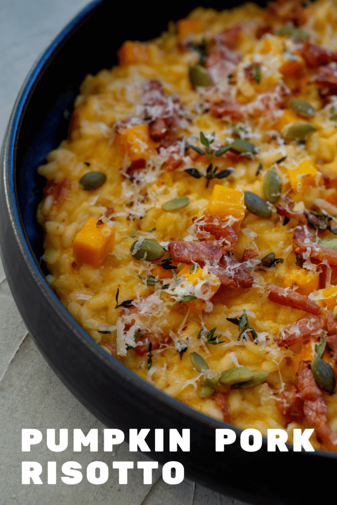 black bowl with pumpkin pork risotto in