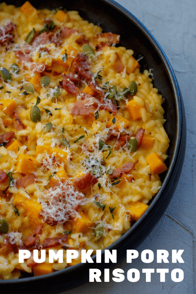 black bowl with pumpkin pork risotto in