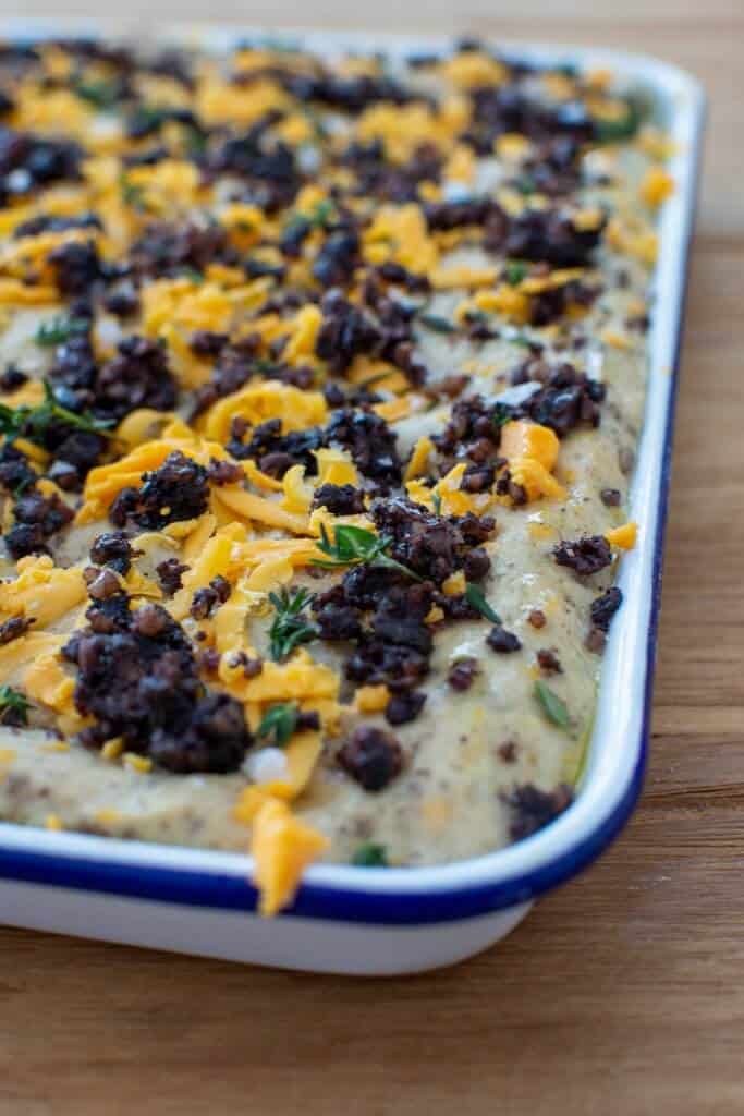 Black Pudding Focaccia uncooked black pudding focaccia on wooden table