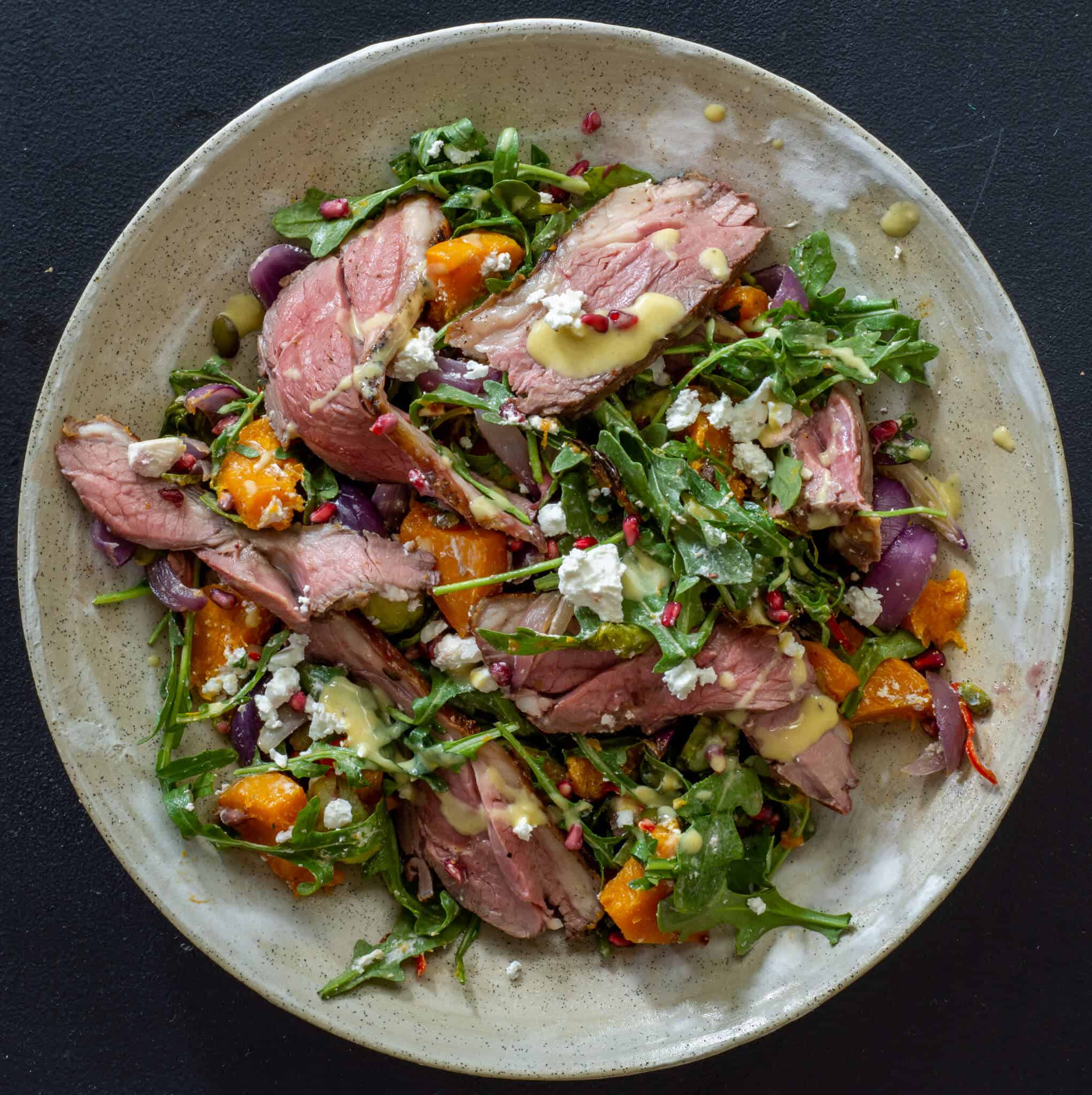 Grilled lamb & roasted veg salad in a bowl