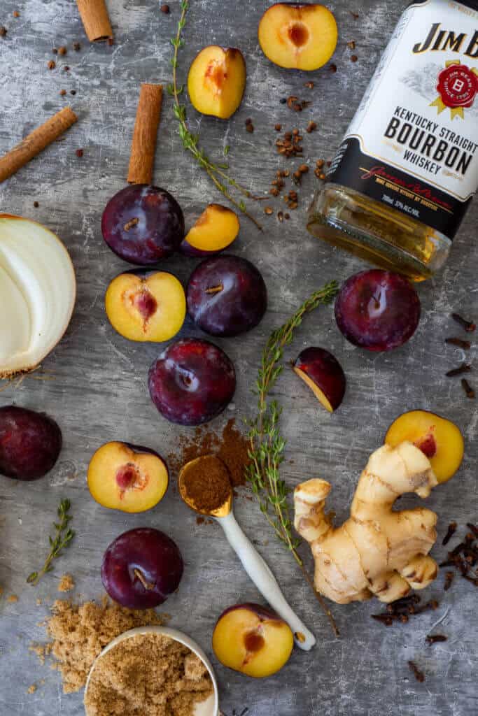 plums, bourbon, onion & spices on a vinyl mat