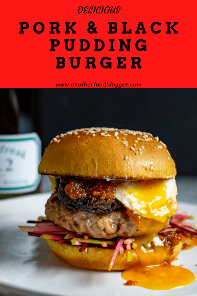 pudding burger with runny egg yolk. Bottle of rieslingfreak riesling in background