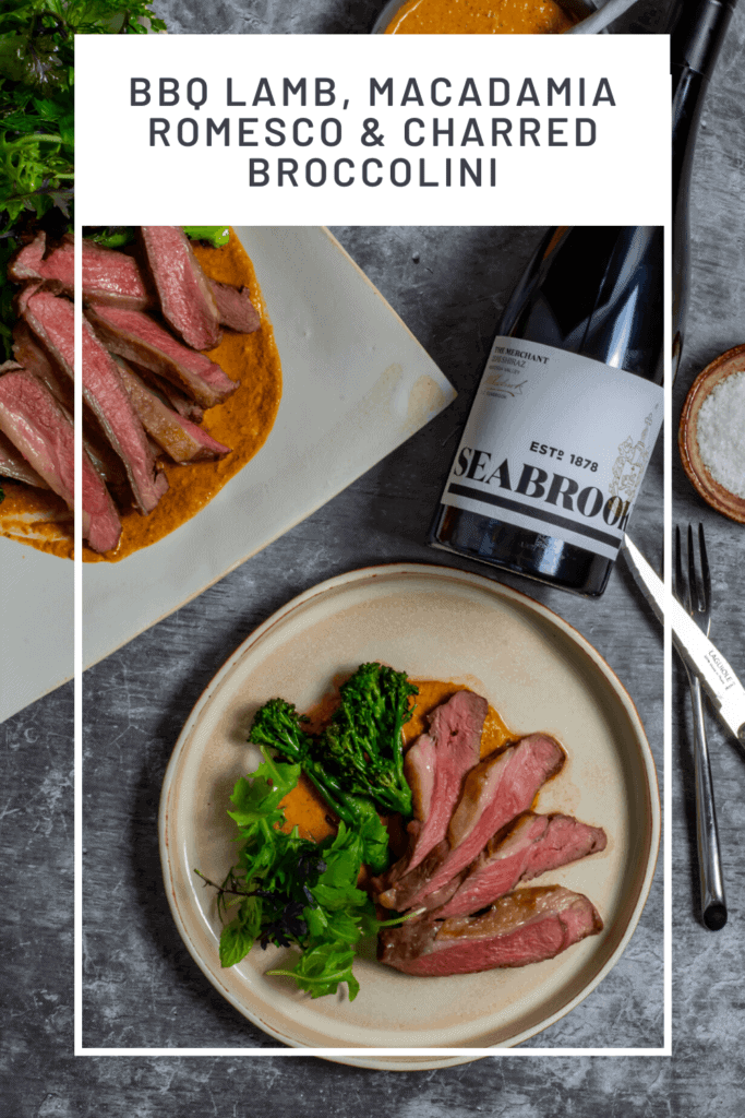 Seabrook wine shiraz, BBQ lamb, romesco sauce & charred broccolini on a table