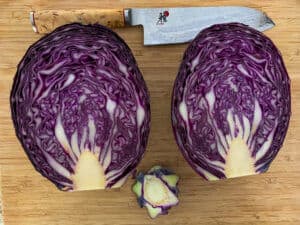 cut red cabbage & chefs knife on board