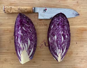 cut red cabbage & chefs knife on board