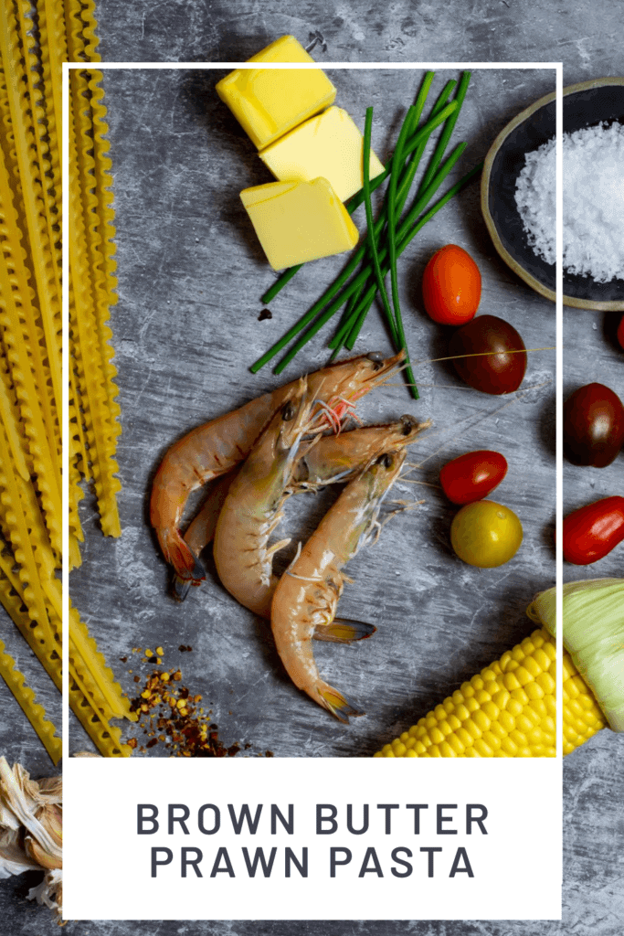 prawns, pasta, butter and vegetables on kitchen counter