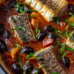 cooked spanish fish stew in casserole dish