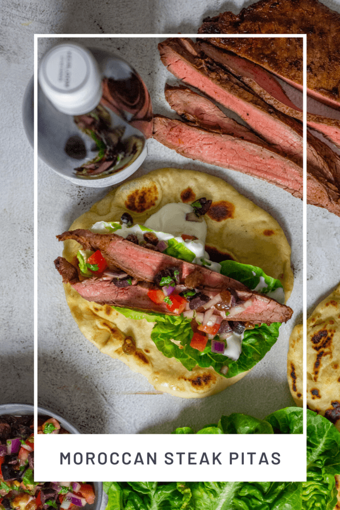 skirt steal, steak pita, red wine on a table