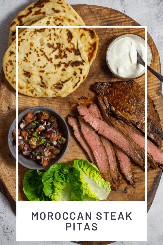 homemade pita bread, skirt steak, lettuce & salsa on wooden board