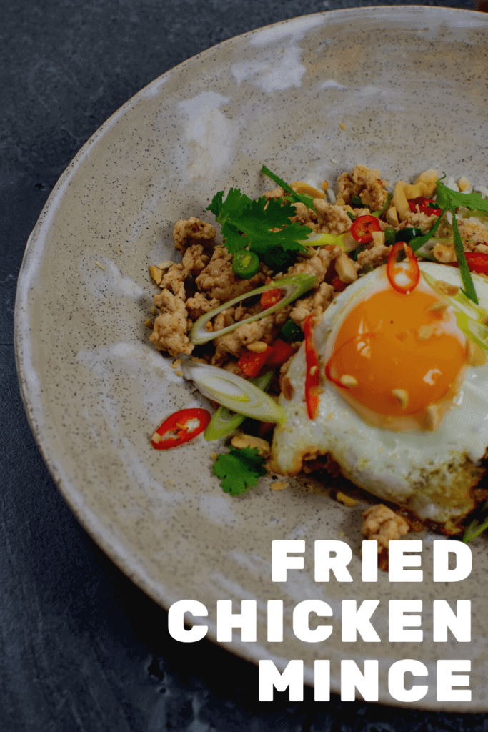 Szechuan fried chicken, rice and fried egg in a bowl