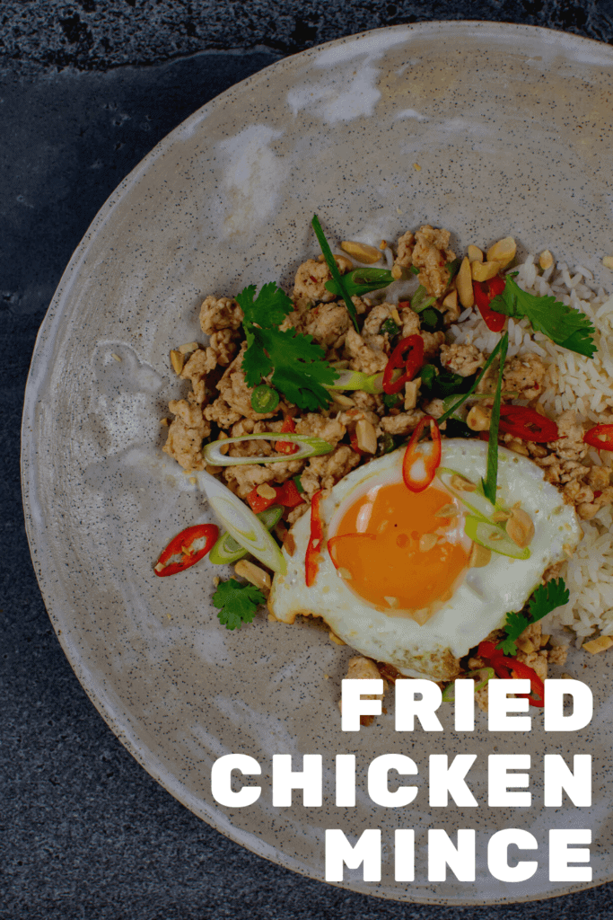 Szechuan fried chicken, rice and fried egg in a bowl