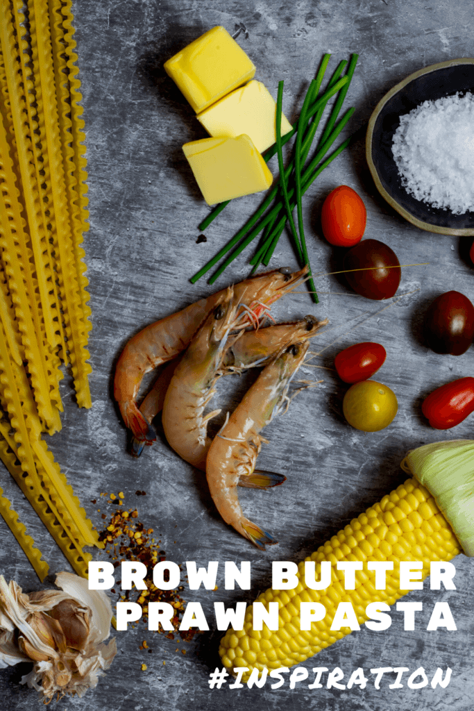 prawns, pasta, butter and vegetables on kitchen counter