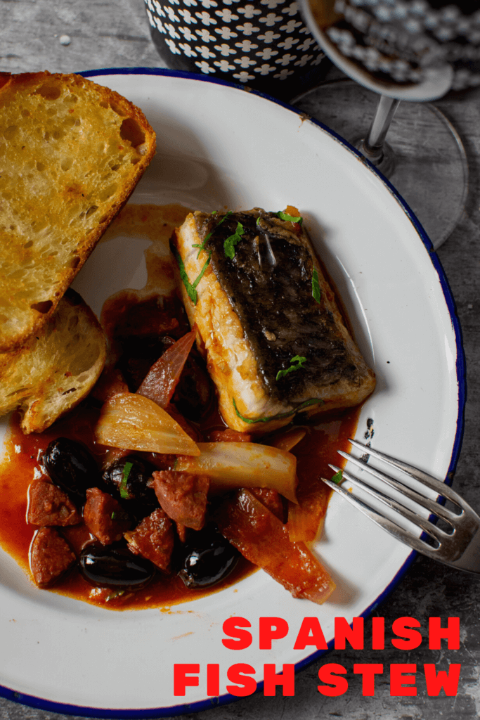 spanish fish stew, grilled bread and glass of heirloom wine
