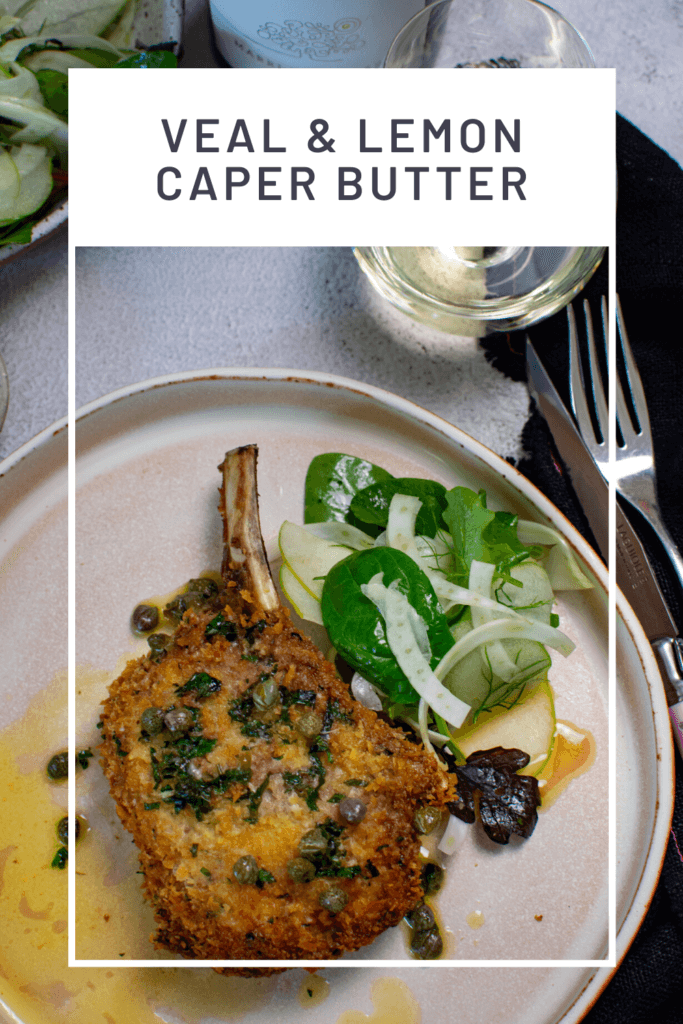 glass of wine, salad, cutelery, napkin & plate with crumbed veal cutlet