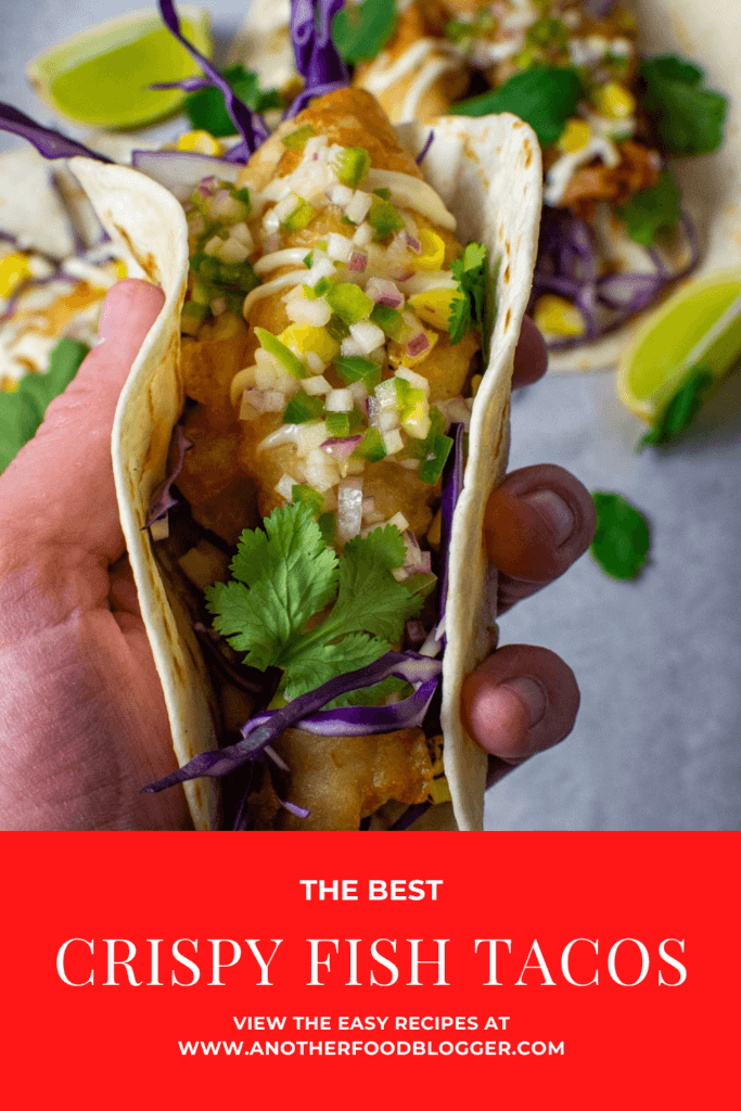 someone holding a crispy fish taco