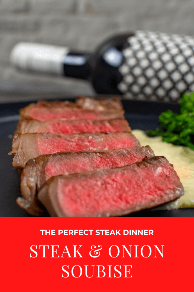 medium rare striploin on a plate. Bottle of heirloom shiraz in background