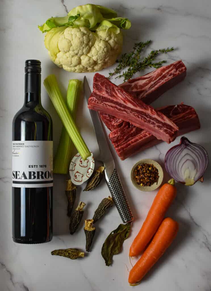 seabrook cabernet sauvignon, short ribs and vegetables on kitchen counter top