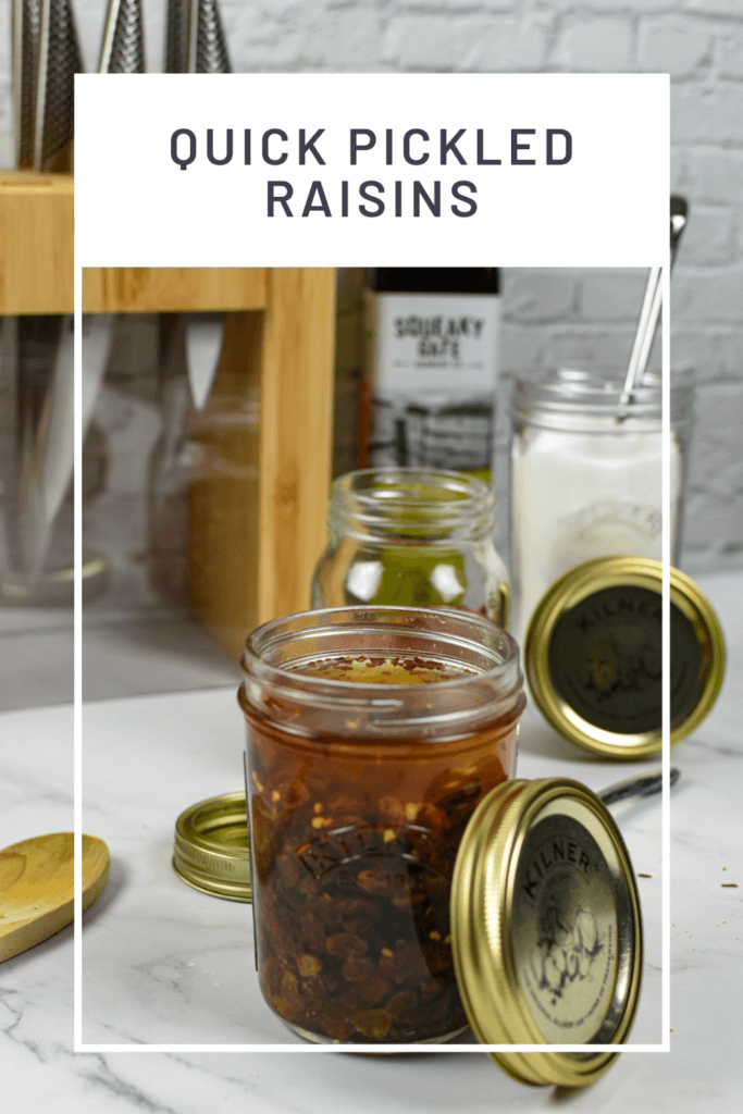 pickled raisins in kilner jar, global knived in background and sugar in a kilner jar