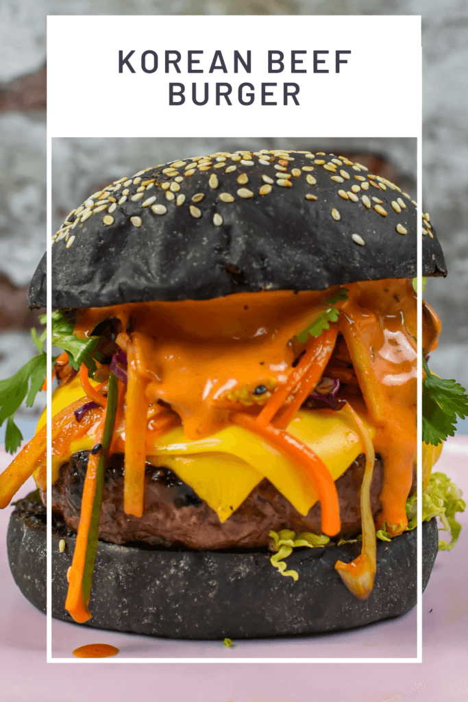 korean beef burger on a pink plate