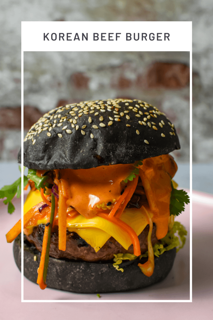 korean beef burger on a pink plate