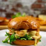 grilled prawn sandwich on a white plate