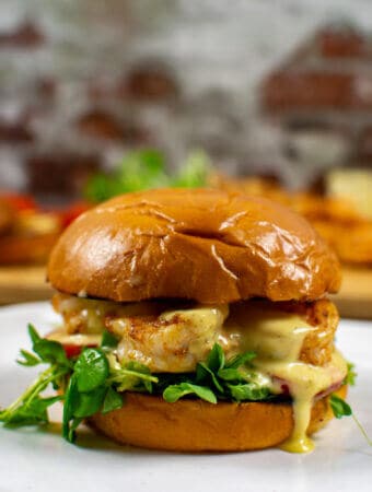 grilled prawn sandwich on a white plate