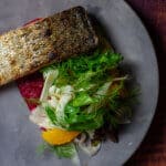 grilled salmon, beetroot hummus & fennel salad on a made of australia plate