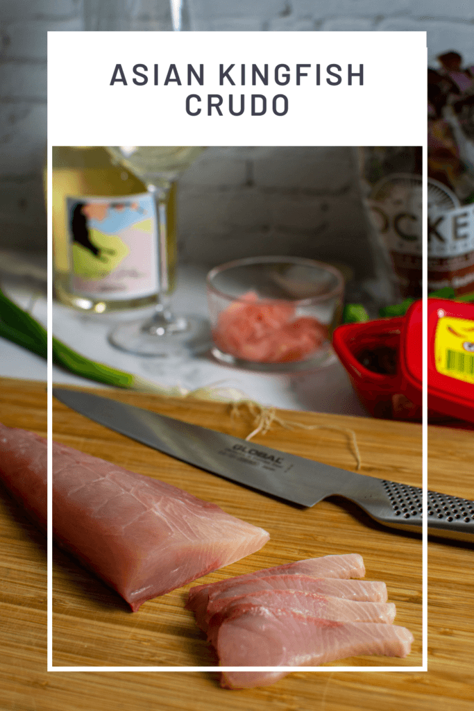 kingfish on a chopping board with crudo ingredients in background