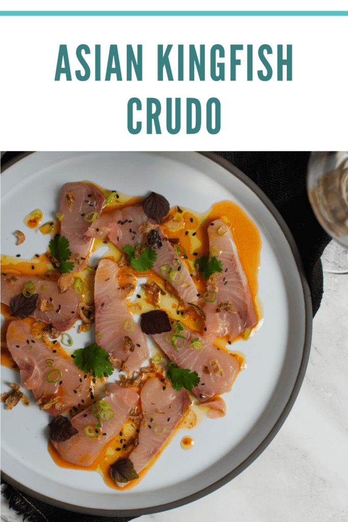 beautiful kingfish crudo on a CB2 plate, black napking and white gate wine co riesling