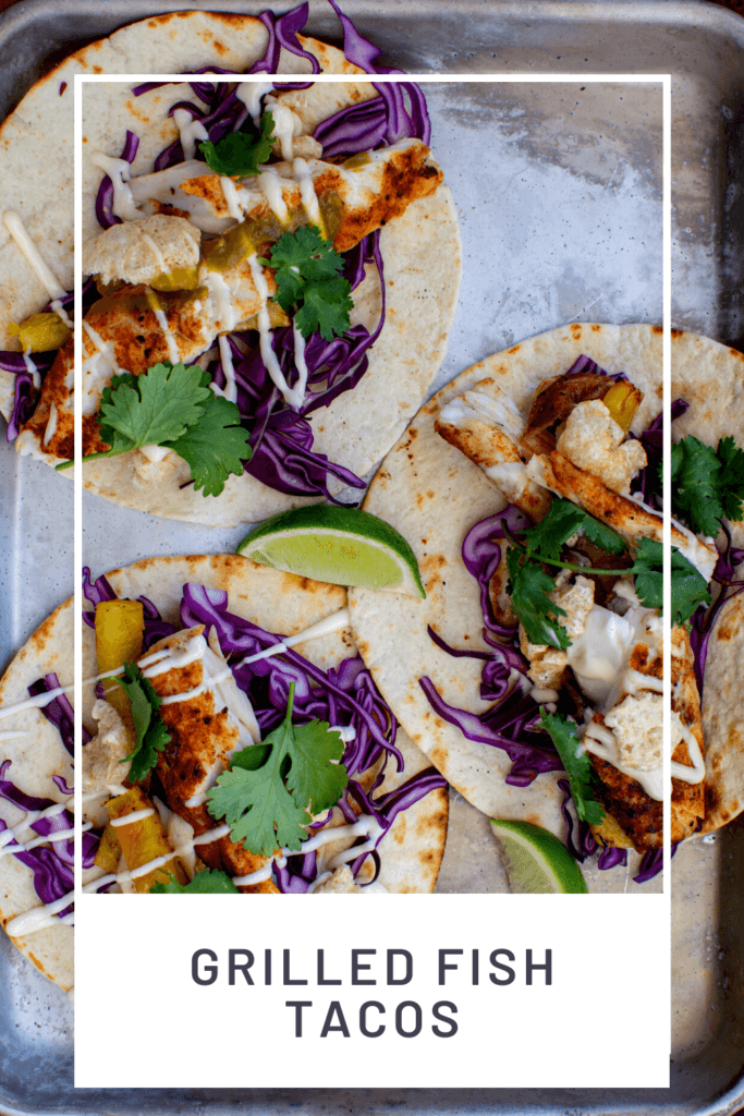 3 grilled fish tacos on a tray