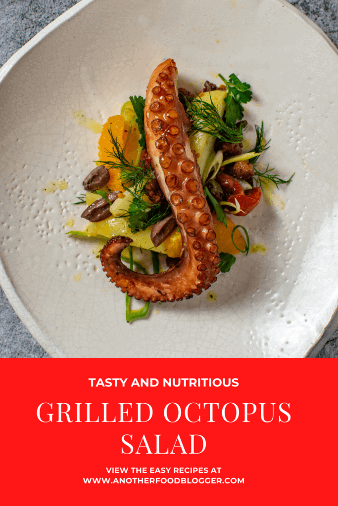 Grilled octopus salad on a white plate