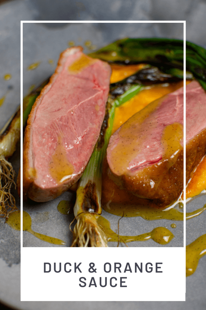 perfectly cooked duck breast, carrot puree & orange sauce on a made of australia plate