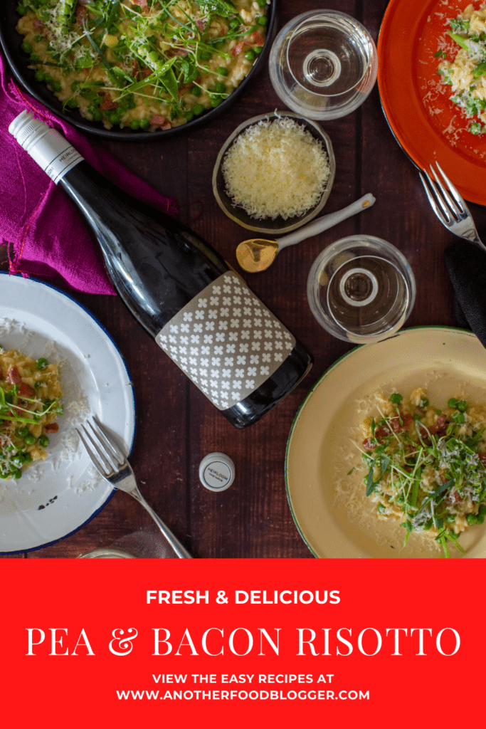 plates of pea & pacon risotto, heirloom chardonnay & wine glasses on a table