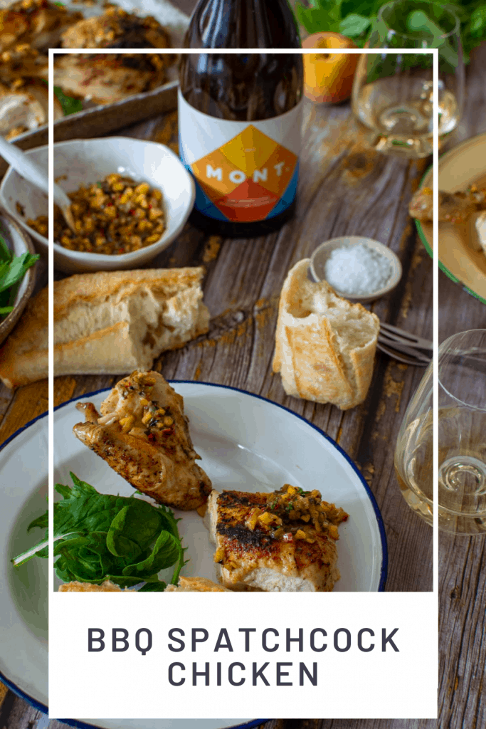 Mont wines, bbq spatchcock chicken & bread on a picnic table