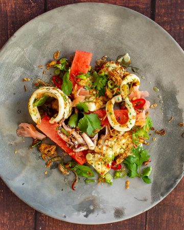 grilled squid salad on a made of australia plate