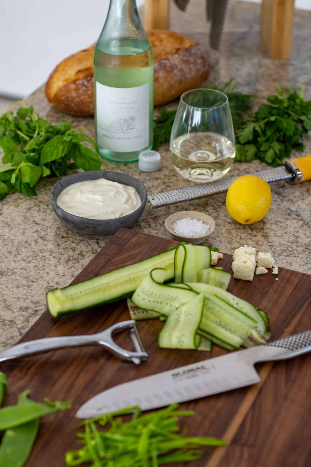 English pea salad ingredients on a global chopping board