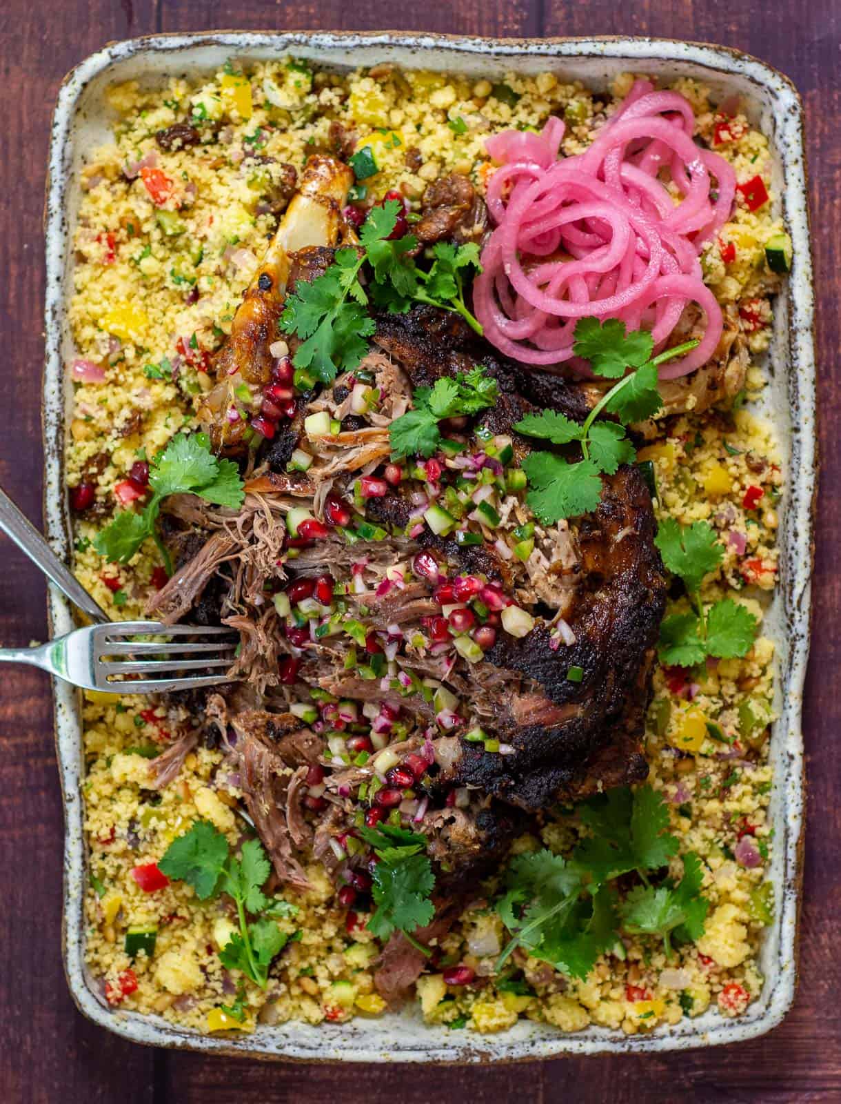 slow cooked moroccan lamb on a bed of couscous and pomegranate salsa
