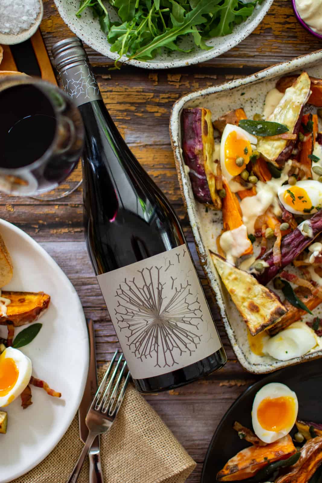 Dandelion vineyard wine and crispy roasted sweet potato salad on a plate