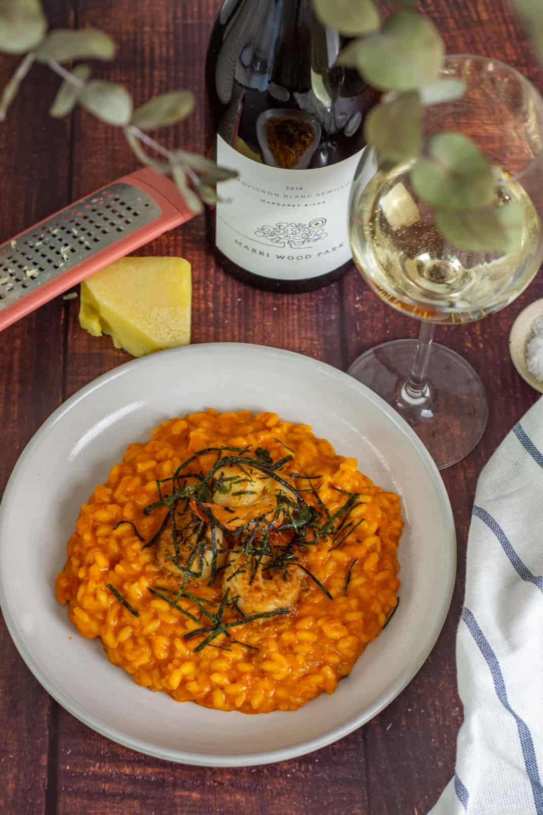 prawn risotto in a white bowl, parmesan cheese and marri wood park white wine