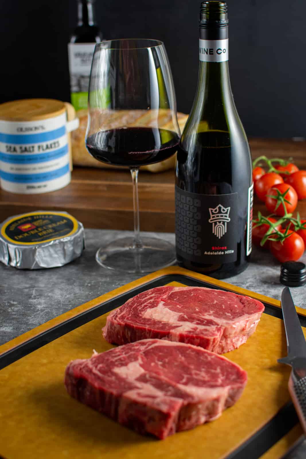 ingredients for steak crostini and a bottle of wine