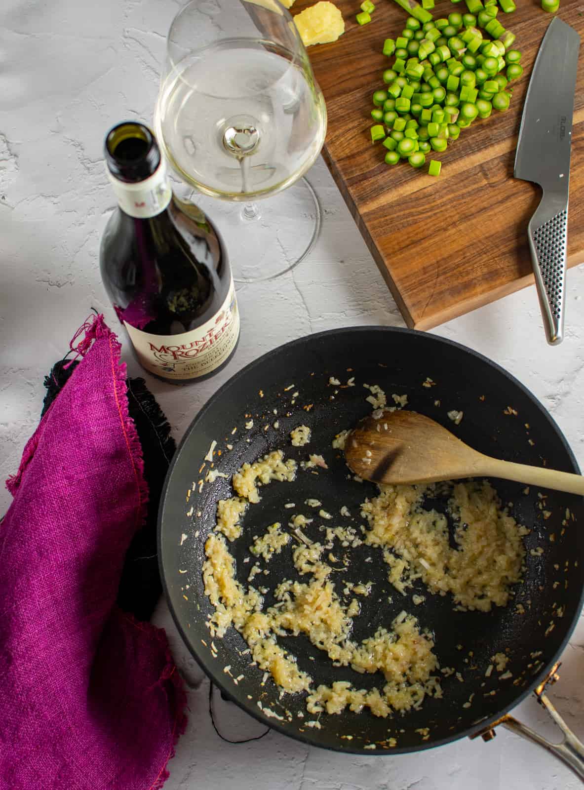 onion and garlic beig cooked in frying pan