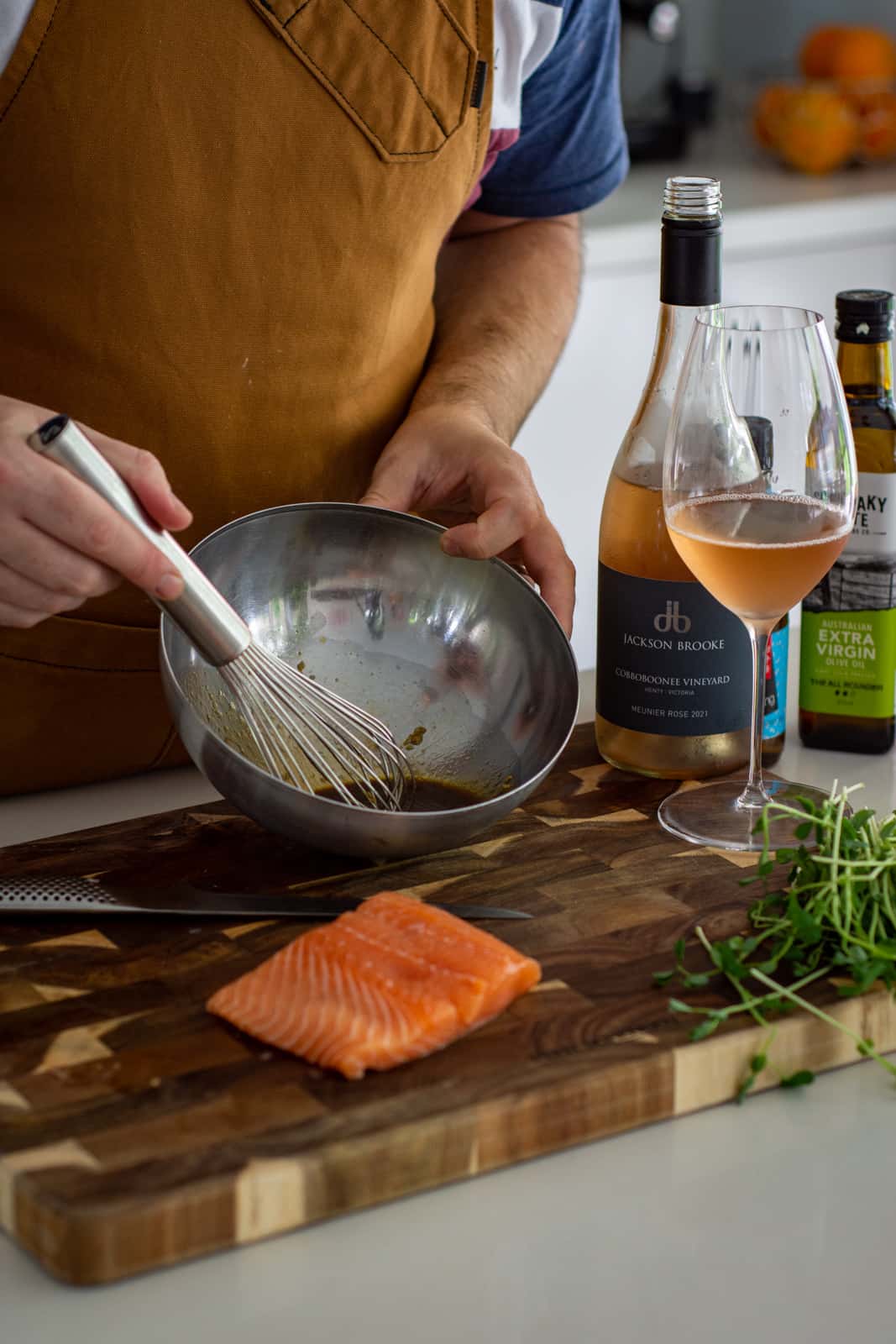 whisking teriyaki marinade in the kitchen